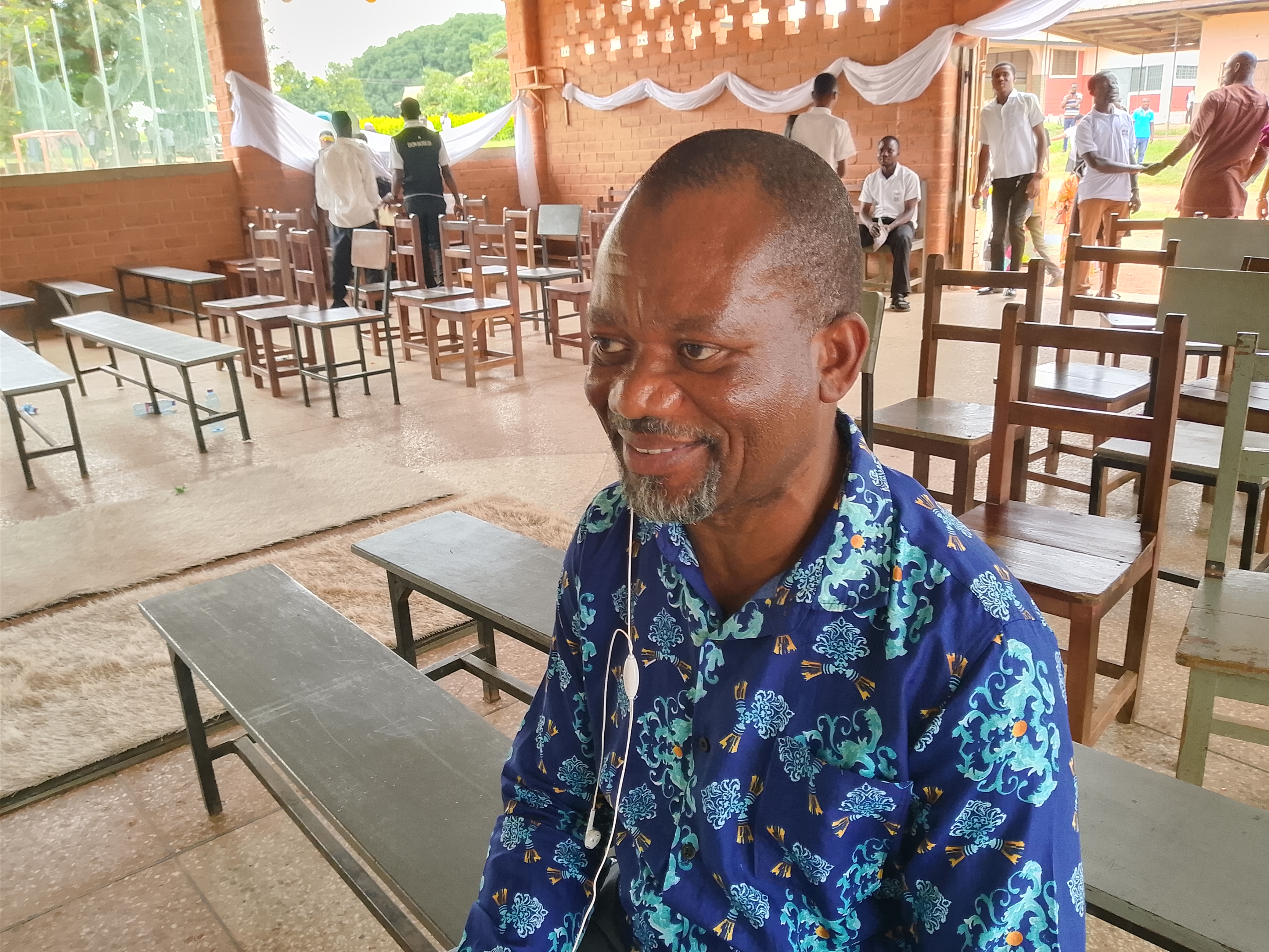 Colleagues congratulating Mr. Sarfo on his years of service